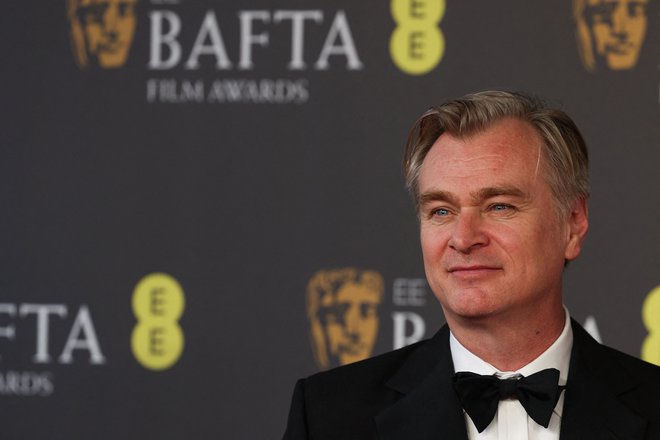 V tretje gre rado. Britanski režiser Christopher Nolan je po dveh nominacijah naposled dočakal prvo bafto. FOTO: Adrian Dennis/AFP