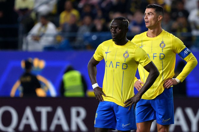 Cristiano Ronaldo in Sadio Mane sta motorja igre savdskega kluba Al Nasr. FOTO: Fayez Nureldine/AFP