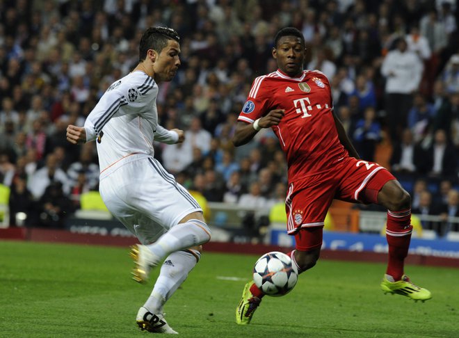 Ko sta se Bayern in Real leta 2018 nazadnje srečala v polfinalu, je Cristiano Ronaldo še igral za bele, zdaj (poškodovani) igralec Reala David Alaba pa za Bavarce. Foto Curto de la Torre/AFP