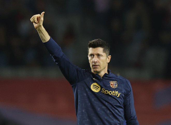 Robert Lewandowski se je veselil zmage proti Getafeju. FOTO: Albert Gea/Reuters