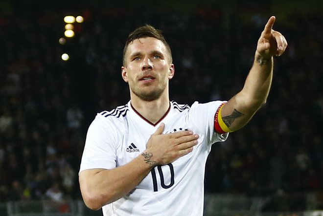 Lukas Podolski je bil svetovni prvak z Nemčijo. FOTO: Wolfgang Rattay/Reuters