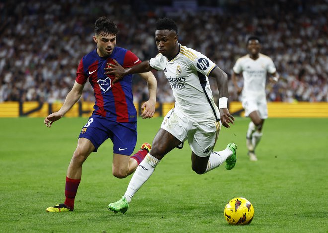 Vinicius Junior in Pedri bosta znova bila veliko bitko. FOTO: Susana Vera/Reuters