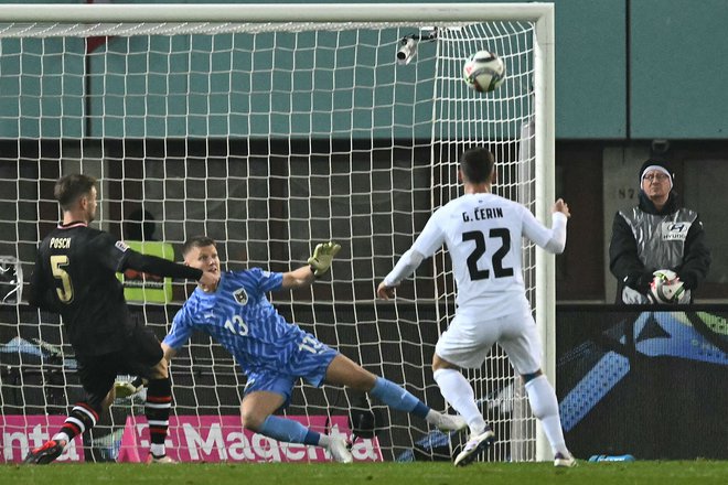 Adam Gnezda Čerin je Sloveniji v končnici tekme prinesel točko in sprožil veliko razočaranje v avstrijskem taboru. FOTO: Joe Klamar/AFP