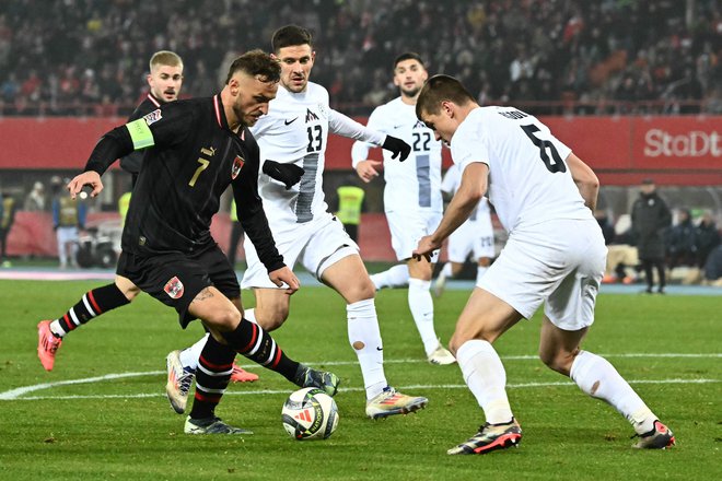 Slovenci so bili tričetrt tekme v senci Avstrijcev, a so bili vztrajni. FOTO: Joe Klamar/AFP