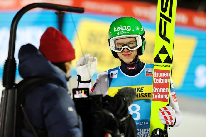 Maximilian Ortner ni skrival veselja po svoji prvi uvrstitvi na zmagovalni oder v svetovnem pokalu. FOTO: Geir Olsen/Reuters