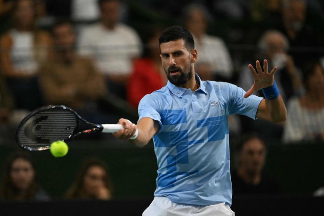 Novak Đoković bo v Avstraliji napadal 25. naslov na turnirjih za veliki slam. FOTO: Luis Robayo/AFP