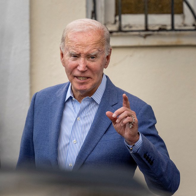 Še vedno demokratski predsednik Joe Biden je obsodil dogodke izpred štirih let. FOTO: Ken Cedeno/Reuters