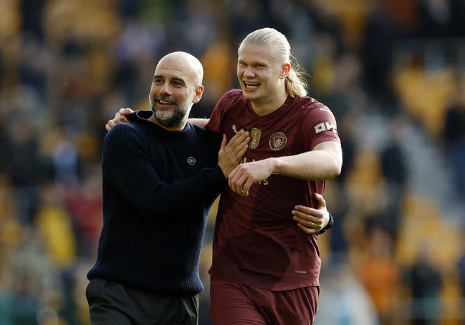 Pep Guardiola in Erling Haaland bosta nadaljevala plodno sodelovanje v Manchestru. Foto Jason Cairnduff/Reuters