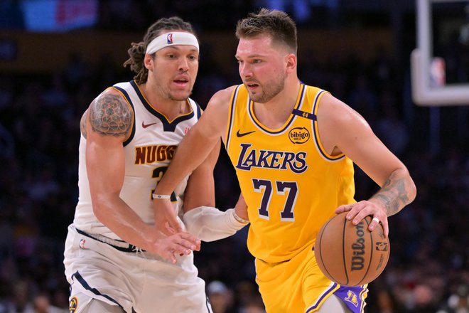 Luka Dončić in Aaron Gordon sta bila prva strelca svojih ekip. FOTO: Jayne Kamin-oncea/Reuters