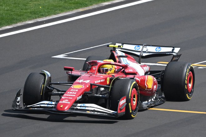 Lewis Hamilton se je veselil prve zmage pri Ferrariju. FOTO: Jade Gao/AFP